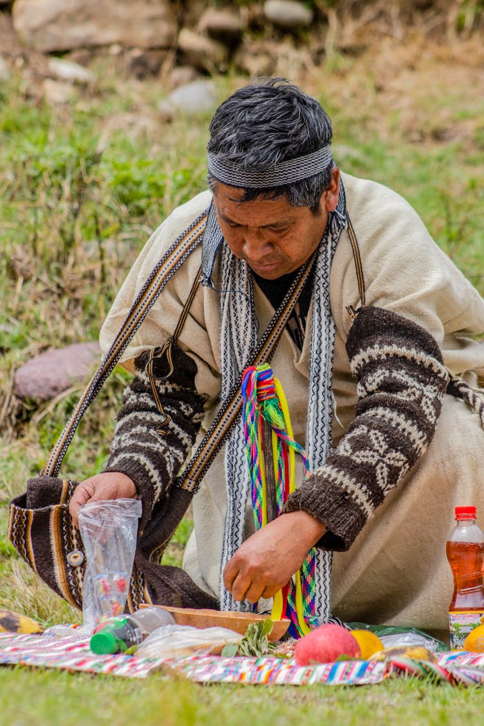 Peruvian man in traditional attire performing a cultural ritual outdoors in Concepción, Junín, Peru.